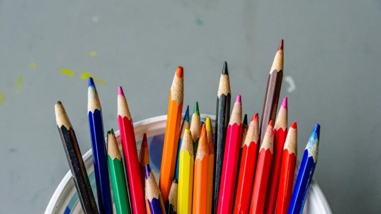 A cup full of sharpened colored pencils, the basic tools of a young artist